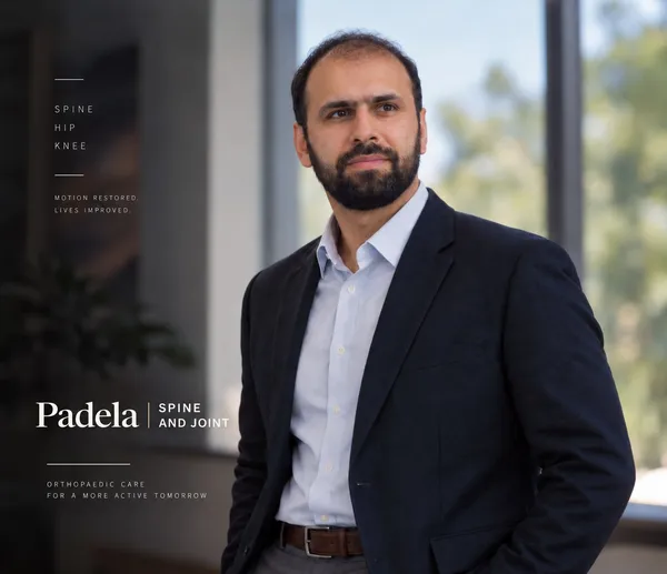 Dr. Muhammad T. Padela in a navy blazer, beside the Padela Spine and Joint logo and the words: Spine. Hip. Knee. Motion restored. Lives improved. Orthopaedic care for a more active tomorrow.